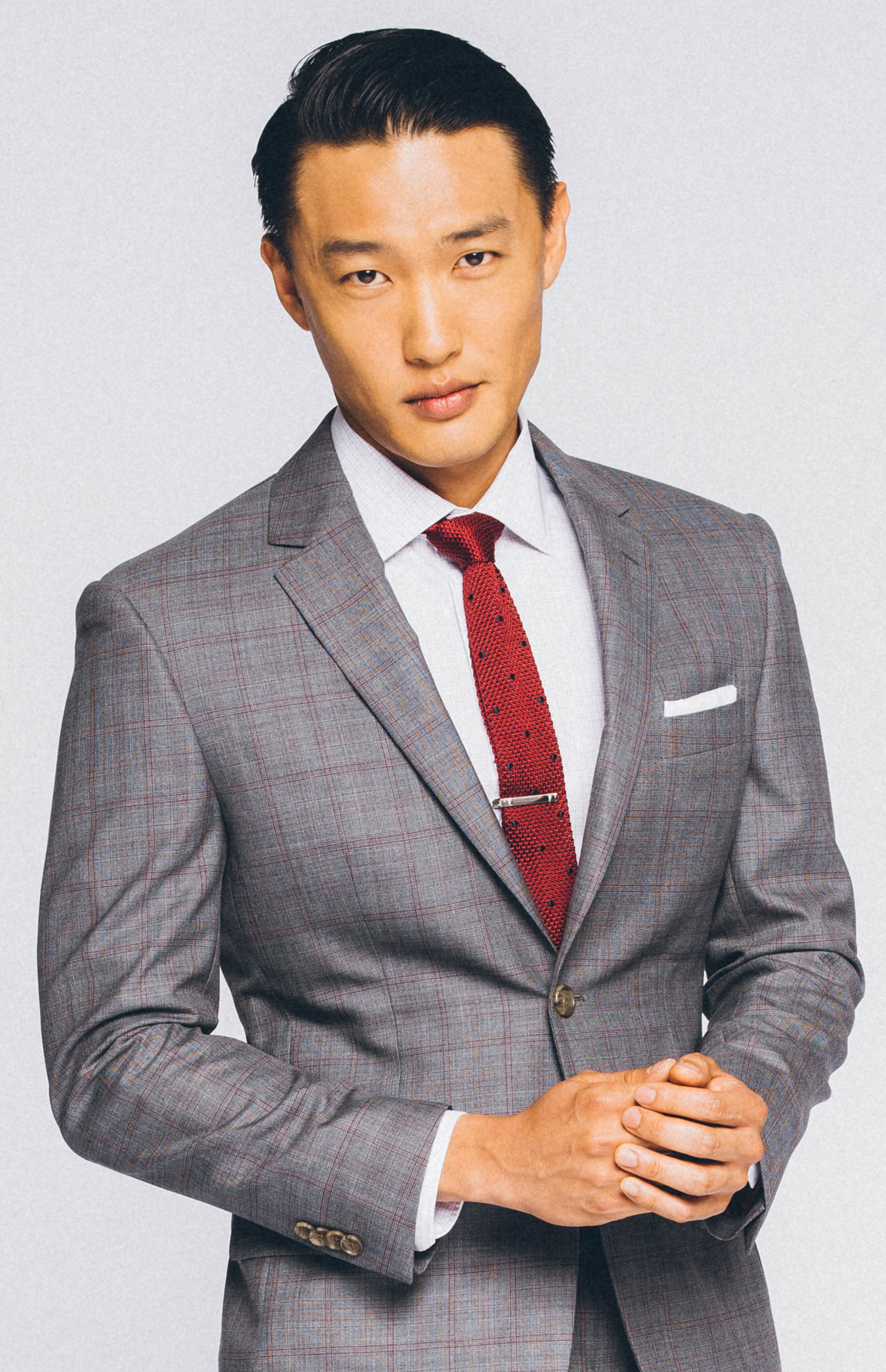 Two trends with one fit: plaid suit and knit tie.